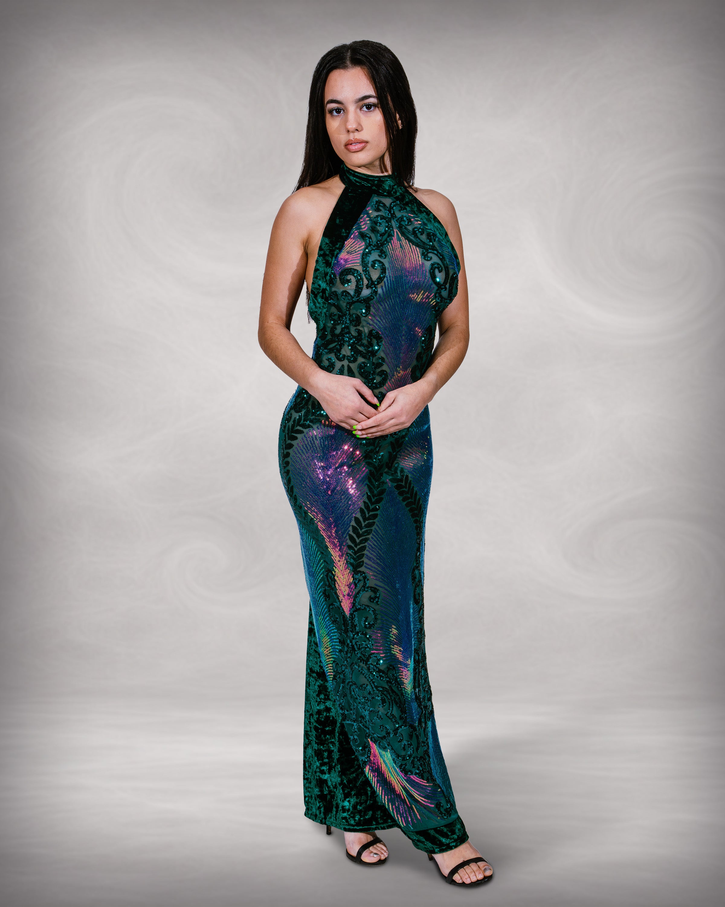 Woman wearing a patterned dress against a plain background [color_id: green-purple]